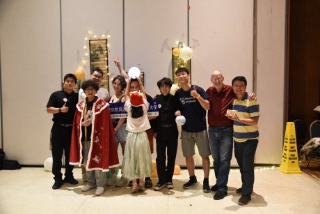 Group of people smiling for the camera.